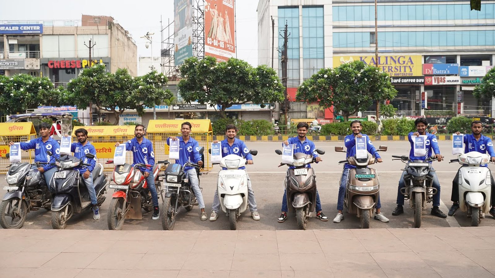 The Docatho delivery riders and their scooters lined up on a Raipur street